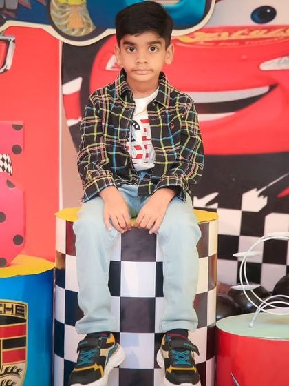 A charming 'Baby Shark' themed birthday party, featuring a vibrant underwater backdrop, character cutouts of the shark family, and blue and yellow balloons, perfect for a fun-filled celebration.