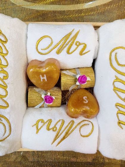 I love how this couple's hamper turned out. It includes bath towels with full names, hand towels with 'Mr' and 'Mrs', and adorable heart-shaped soaps with their initials.