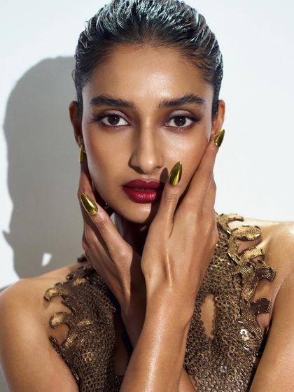 Liquid gold! I designed these striking gold chrome stiletto nails for model Dayana Erappa for a Vogue event. The metallic shine gives a powerful and luxurious finish that stands out in photos.