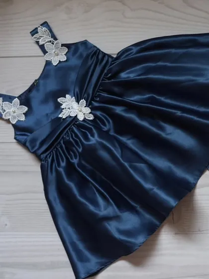 This deep blue satin is adorned with delicate white lace flower appliques. I place each one by hand to create a beautiful, cascading floral effect.