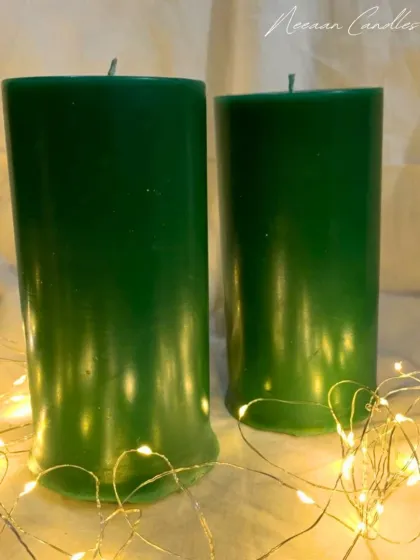 Enchant your space with the glow of our handcrafted green pillar candles, bringing warmth and a touch of nature to any setting.