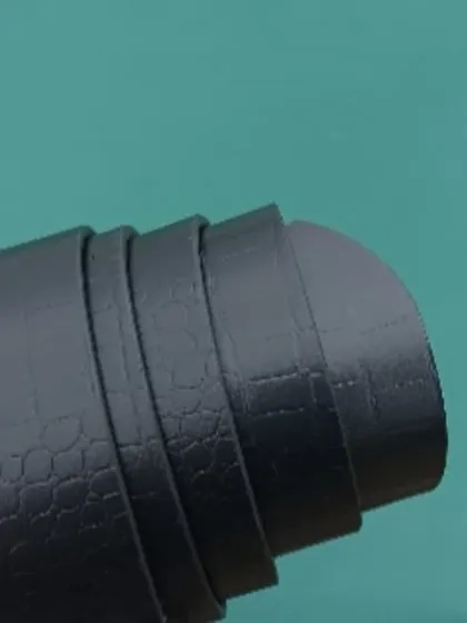 A detailed shot of the black leather belt, showing its texture and flexibility.