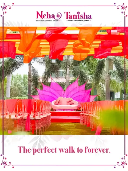 This is more than an aisle; it’s the perfect walk to forever. For this colorful event, we created a stunning path with bright overhead draping and a lotus-themed stage, designing the entire journey with emotional impact.