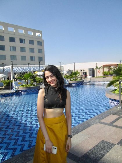 Enjoying a sunny day by the pool, likely before or after a gig. Traveling for performances is one of the best parts of my job.