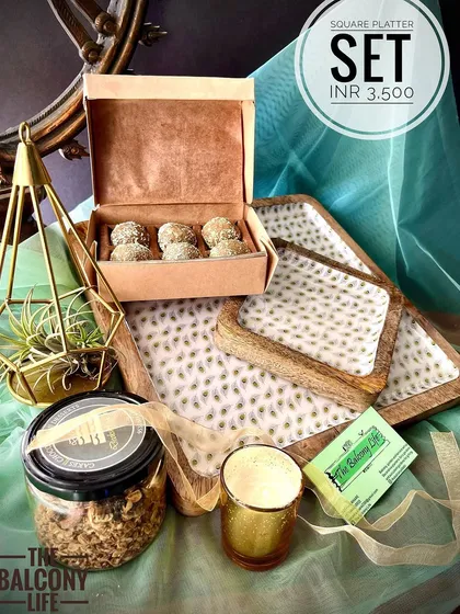 Why have one platter when you can have a set? This hamper is perfect for those who love to host. It includes a beautiful set of three nesting square platters, a jar of spent grain granola, a box of our signature sweets, and a soy wax candle to set the mood.