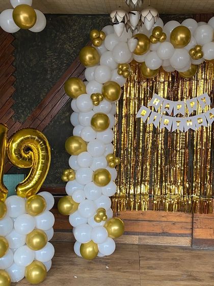 Another angle of the classic white and gold 19th birthday decoration.