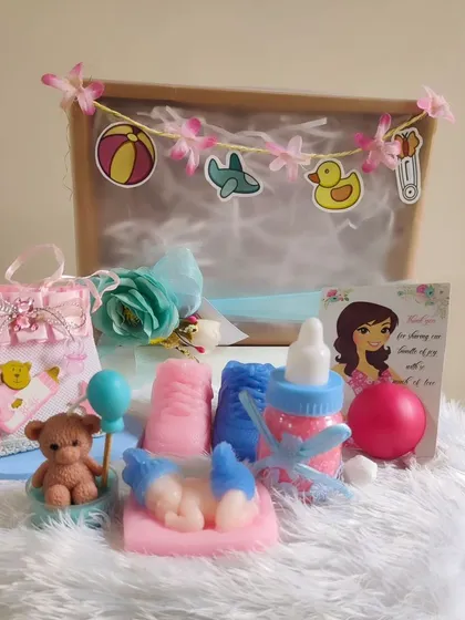 Another view of the baby shower hamper, showing the arrangement of the handmade soaps and gifts.