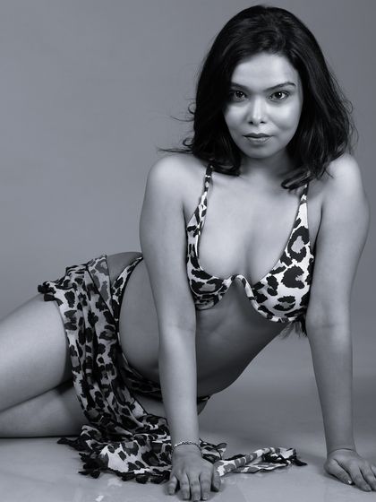 A black and white version of a reclining pose, adding a classic and timeless feel.