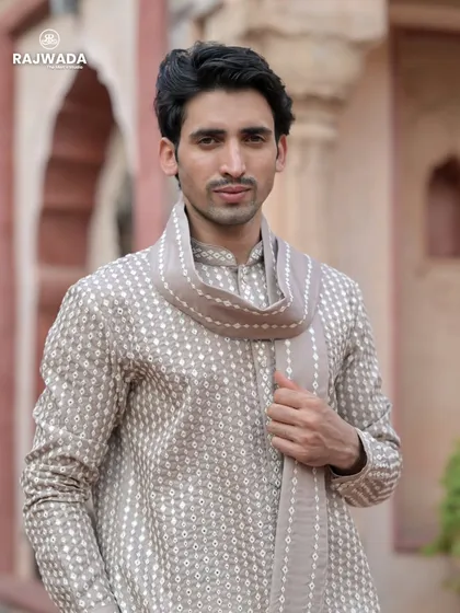 A close-up of the beige printed kurta, highlighting the subtle pattern and the soft fabric. The matching stole adds a touch of sophistication to this comfortable and stylish outfit.