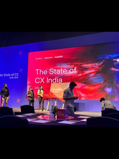 Rehearsing the reveal moment for 'The State of CX India 2025'. Our team walks through every mechanical and physical cue multiple times.