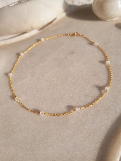 A simple, elegant shot of my Rainbow Moonstone ball choker. It's a stone that brings balance, hope, and inner confidence.