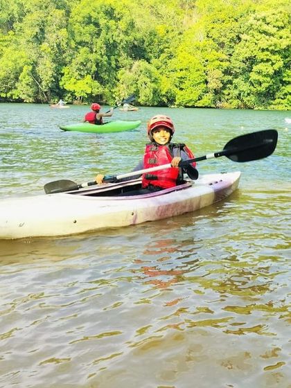 Another happy camper enjoying the serene experience of kayaking on the calm sections of the river.