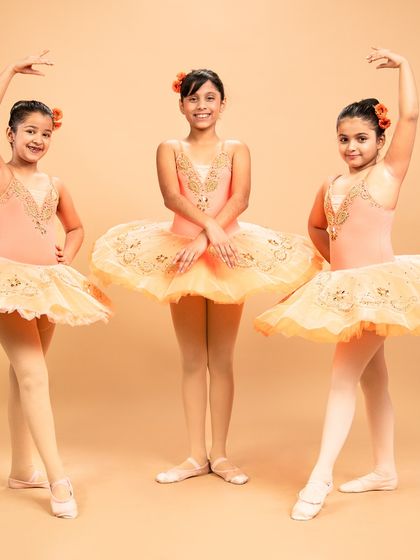 Our dancers are ready to grace the stage in 'The Waltz of the Flowers.' These photos capture their excitement and poise before bringing this timeless piece from The Nutcracker to life.