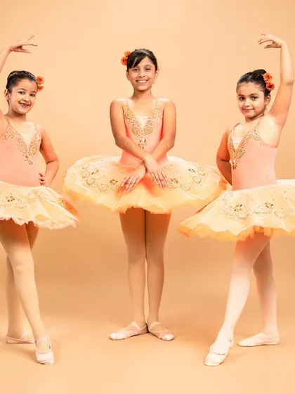 Our dancers are ready to grace the stage in 'The Waltz of the Flowers.' These photos capture their excitement and poise before bringing this timeless piece from The Nutcracker to life.