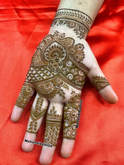 Beauty in every stroke. A single hand design with intricate floral and paisley patterns.