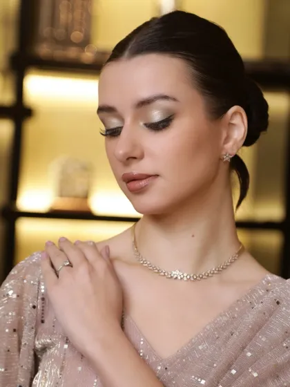 This is the essence of our makeup philosophy: timeless elegance. Here, we've crafted a sophisticated look with shimmering eyeshadow, flawless skin, and a soft lip, perfect for any high-end event where poise and grace are key.