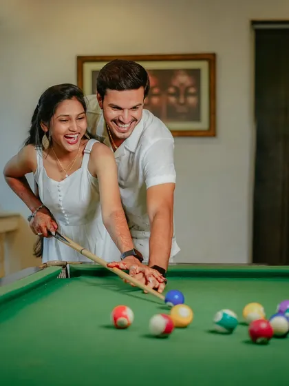 Your pre-wedding shoot should be fun. I love capturing these candid, playful moments, like this shot of Suchita and Om Prakash sharing a laugh over a game of pool. It is these real smiles that make the best memories.