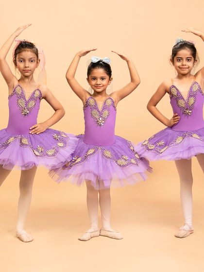 More beautiful poses from our 'Coppélia Reimagined' piece. These young dancers masterfully blend whimsical, doll like nuances with the foundational grace of ballet.