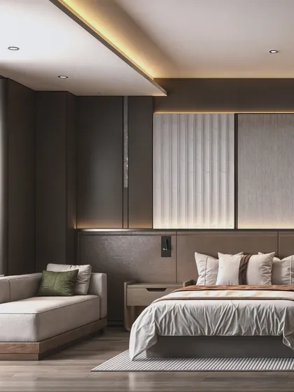 Another view of the guest room, highlighting the comfortable chaise lounge and the layered lighting design.