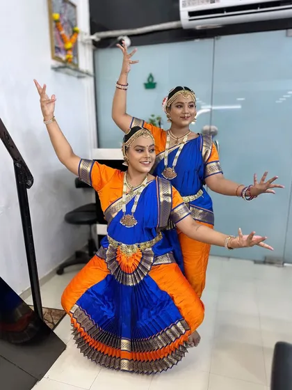 These two dancers are ready for their Bharatanatyam performance. I created a classic stage makeup look with bold eyes and traditional temple jewellery and costumes.
