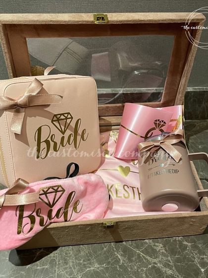 Curated with love for the blushing bride-to-be. This elegant hamper includes a "Bride" themed sipper, eye mask, jewelry box, and other essentials to build excitement for the big day.