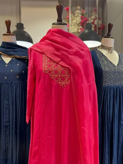 A wider shot of the anarkalis, showing how the solid colors are enhanced by the subtle gold and silver embroidery on the yokes.