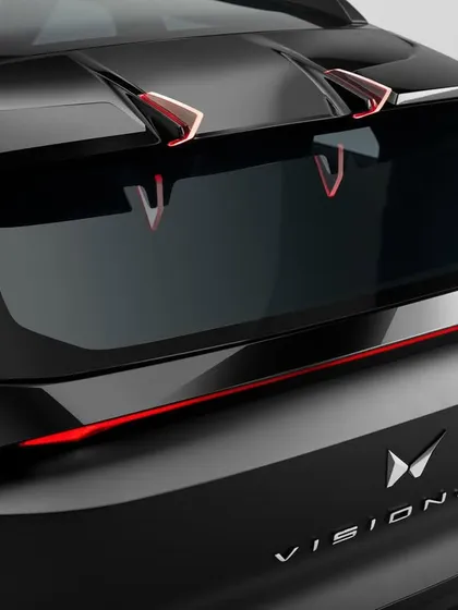 This is a detailed shot of a top-secret concept car for Mahindra. Automotive photography, especially for unreleased models, demands extreme precision in lighting to accentuate every design line while managing reflections on the unique matte finish.