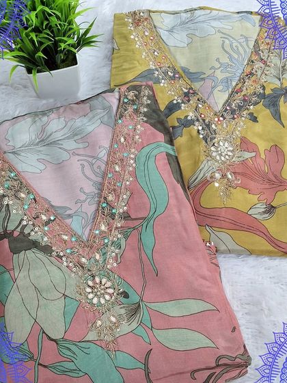 A pair of fancy dress materials with digital floral prints and embellished necklines. These sets in pink and yellow are perfect for creating vibrant and stylish occasion wear.