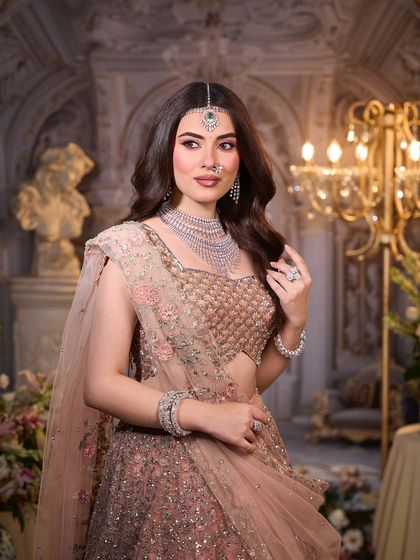 A candid moment from the shoot. The makeup looks fresh and natural, perfect for the bride who wants to feel comfortable and beautiful.