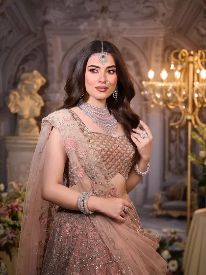 A candid moment from the shoot. The makeup looks fresh and natural, perfect for the bride who wants to feel comfortable and beautiful.