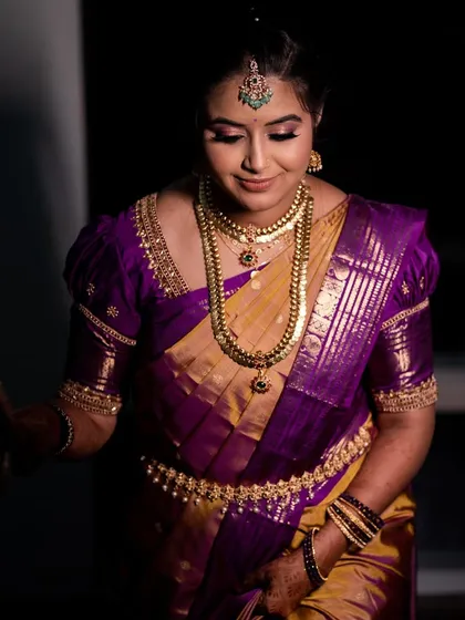 A soft, elegant portrait of Varshini. The makeup enhances her features beautifully.
