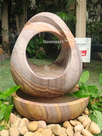 The intricate, hand-carved shape of this modern fountain is a testament to the skill of my artisans. The piece is designed to be beautiful from every angle.