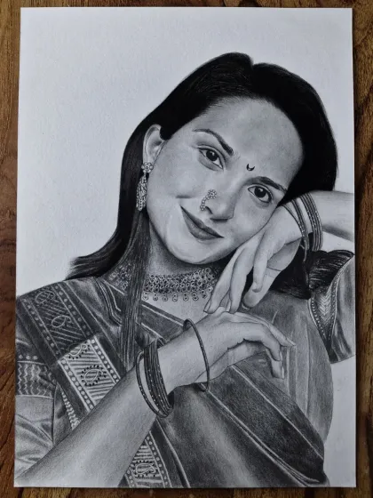 A detailed pencil sketch of a woman in beautiful traditional attire. I enjoy the challenge of drawing intricate details like the fabric of the saree and the design of the jewelry to create an elegant portrait.