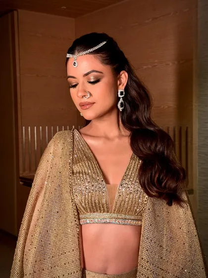 Serving shimmer, glory, and everything iconic. This look features a modern mermaid-like magic with golden tones, glistening skin, and a bold, defined eye.