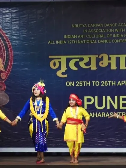 The dancers hold hands, symbolizing unity and friendship in this scene from "PREMA VINOD." It reflects the community spirit we foster at Nritya Gurukul.