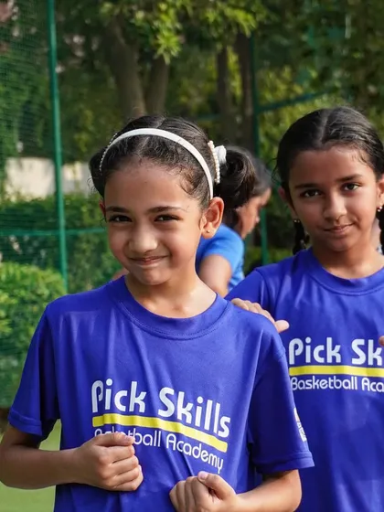 Two players ready for practice. Our holistic approach focuses on developing skills and character, helping kids push beyond their comfort zones.