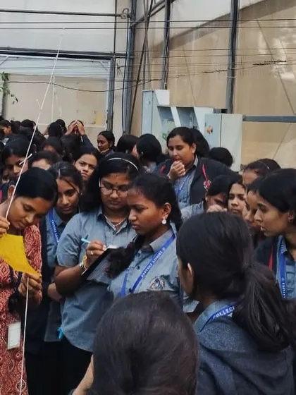 Students from Trinity College, Mysore, gather around for a lesson on integrated pest management using sticky traps. We focus on practical, sustainable solutions in our training.