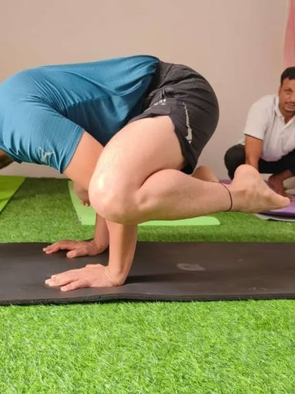 Here is the full Crow Pose. Balancing on your hands like this makes you feel strong and light.