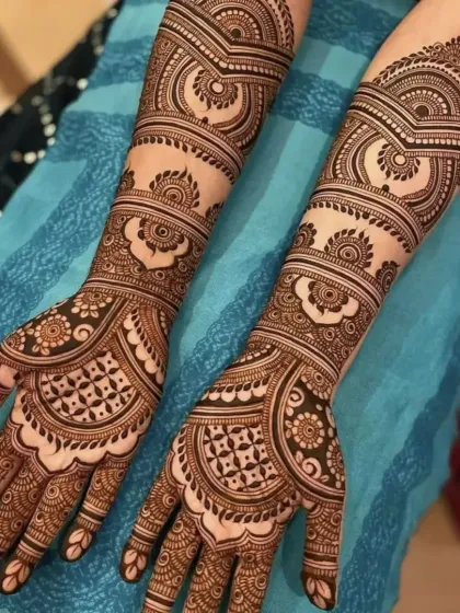 A modern take on bridal mehndi, with bold, curved patterns and clean lines. This style is perfect for the contemporary bride.