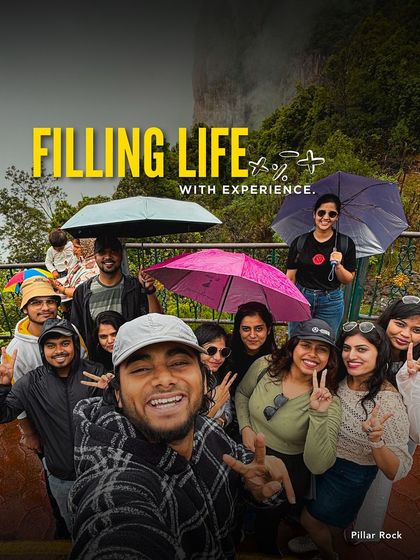Filling life with experiences, one trip at a time. This selfie captures the joy of our crew at Pillar Rock, Kodaikanal, on a misty monsoon day. It is all about doing more of what you love.