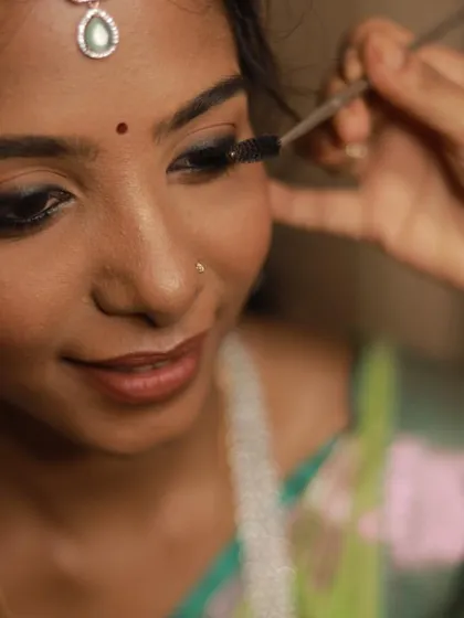 A behind-the-scenes shot of applying mascara to complete Gayathri's smoked-out liner look.