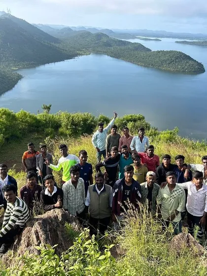 A moment of achievement for our participants after a trek, overlooking the stunning expanse of the Vani Vilas Sagara reservoir. Our camps are set in some of Karnataka's most breathtaking landscapes, offering views like this as a reward for their efforts.