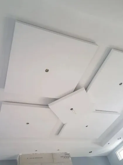 This image shows a geometric design with floating squares after the base construction. The holes are for installing spotlights.