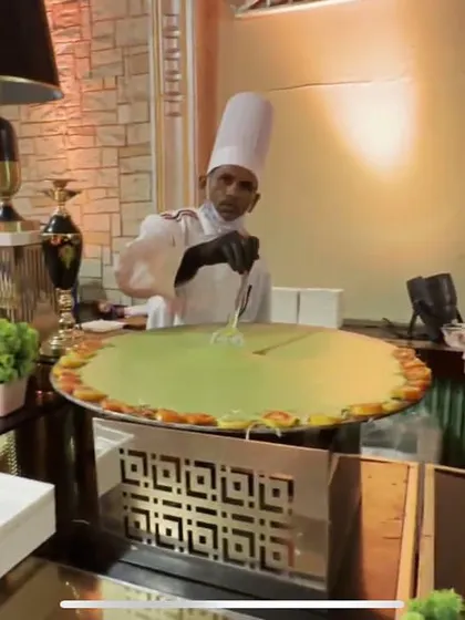 This is my live 'Tamatar ki Chaat' station in action. Guests love the theatre of watching our chefs prepare this tangy and savoury street food classic right before their eyes, served hot and fresh.
