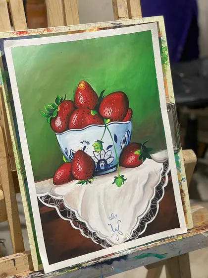 Look at the vibrant detail in this still life of strawberries, created by a student using poster colors. This shows how we build strong foundational skills in color theory and brushwork, even with simple materials.