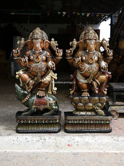 A pair of impressive Ganesha statues, each over 40 inches tall. One depicts Ganesha dancing on his vahana, the mooshak (rat), while the other shows him dancing on a lotus, showcasing our versatility in large-scale divine forms.