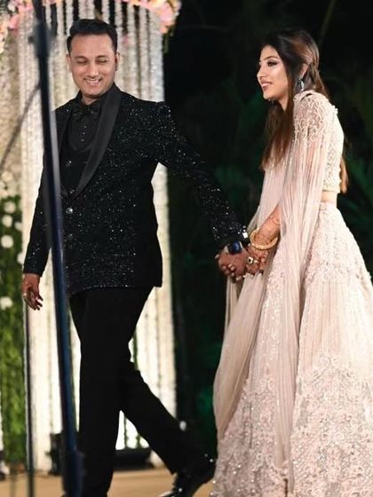 The same all-over katdana work suit, seen in motion. The bespoke fit ensures it looks sharp from every angle, whether you're walking or posing for photos.