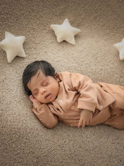 Dreaming among the stars. This simple setup with soft star props is so sweet and magical for a newborn session.