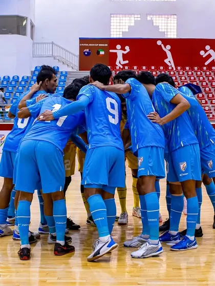 The team huddle before a crucial match for the Indian Futsal Team. Together, we are stronger.
