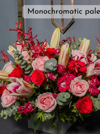 This monochromatic palette of deep reds and pinks creates a luxurious and moody aesthetic, a key trend for 2025.